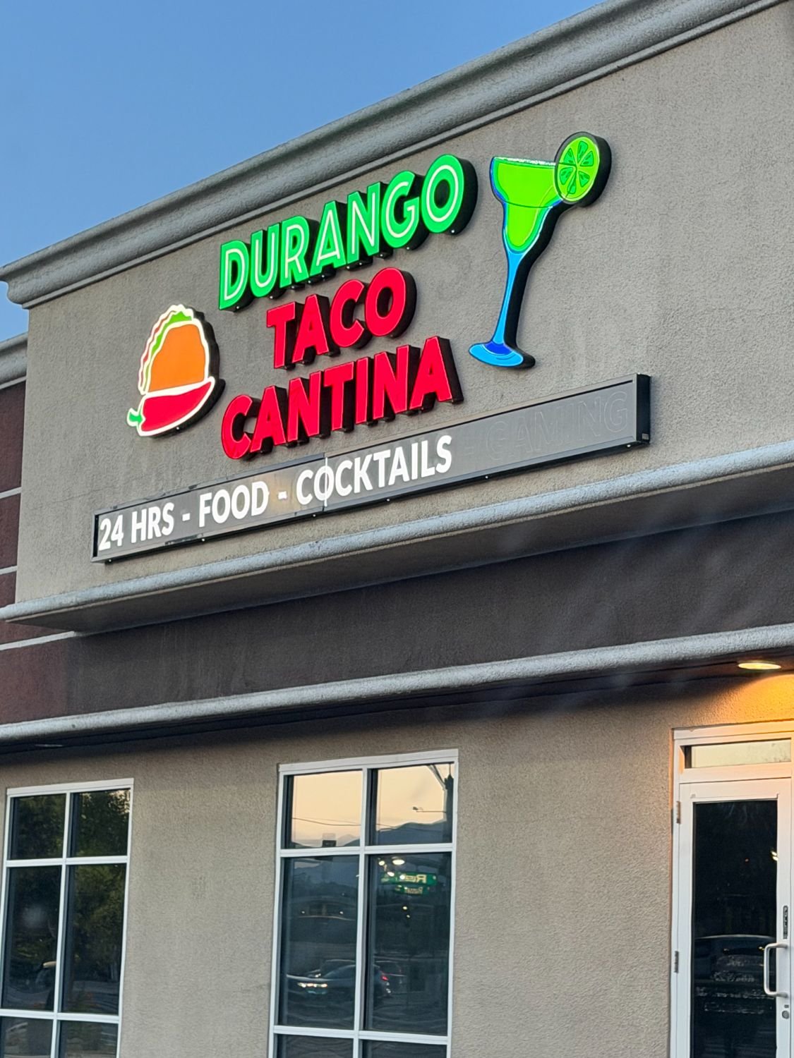 Sign lit at dusk